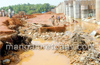 Surge in river water washes away construction equipment